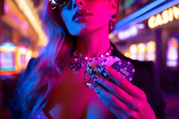 A confident dealer surrounded by casino chips inviting players to access their SLO16 account, reflecting quick and easy login options.